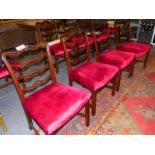 NINE CARVED MAHOGANY CHIPPENDALE STYLE PIERCED LADDER BACK DINING CHAIRS WITH MOULDED STRAIGHT