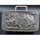 A WHITE METAL BEARING PORTUGUSE SILVER MARKS HAND CHASED HINGED COVERED BOX WITH A GILDED INNER,