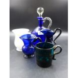 THREE PIECES OF INSCRIBED GLASS, A BLUE GLASS JUG AND A CARAFE AND STOPPER.