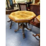 A VICTORIAN CARVED AND INLAID WALNUT OCTAGONAL CENTRE TABLE WITH TURNED SUPPORTS AND SCROLL LEGS.
