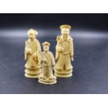 THREE CHINESE IVORY CHESS PIECES REPRESENTING AN EMPEROR. H.10CMS AND EMPRESS AND BISHOP.