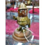 A RARE CAR MASCOT IN THE FORM OF A POLICEMAN BY JOHN HASSALL, PATINATED BRASS BODY AND HELMET WITH