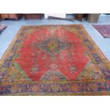 F. AN ANTIQUE TURKISH OUSHAK CARPET. 412 X 348CMS.