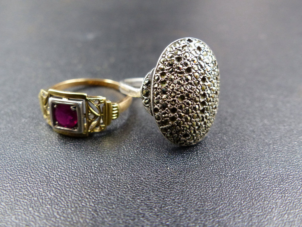 AN ART DECO YELLOW METAL RUBY RING. WEIGHT 3GRMS TOGETHER WITH A WHITE METAL MARCASITE PAVE SET