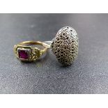 AN ART DECO YELLOW METAL RUBY RING. WEIGHT 3GRMS TOGETHER WITH A WHITE METAL MARCASITE PAVE SET