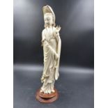 A CHINESE IVORY FIGURE OF GUANYIN, THE ROBED FIGURE STANDING WITH A ROSARY HELD IN HER RIGHT HAND,