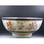 A SAMSON FAMILLE ROSE EXPORT STYLE ARMORIAL PUNCH BOWL DECORATED WITH FLORAL SPRAYS. DIA.29.5CMS.