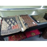 THREE ETHNIC WOVEN TEXTILE PANELS, THE SMALLER TWO WITH DIAMOND SHAPED GEOMETRICAL DESIGNS, THE