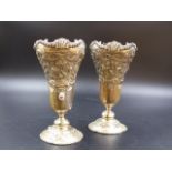 A PAIR OF HALLMARKED SILVER FLORAL DECORATED VASES, DATED 1907 FOR GOLDSMITHS & SILVERSMITHS CO.