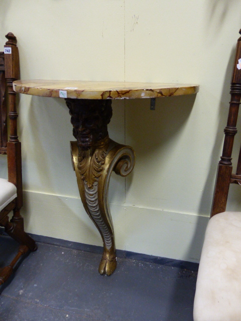 A CARVED PAINTED AND GILTWOOD DEM-ILUNE CONSOLE TABLE IN THE KENTIAN MANNER WITH FAUX MARBLE TOP