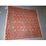 A TURKISH TRIBAL RUG. 163 X 96CMS TOGETHER WITH AN ANTIQUE TEKKE BOKHARA RUG. 138 X 130CMS. (2)