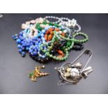A SELECTION OF VINTAGE BEADS TOGETHER WITH A PAIR OF SILVER SUGAR NIPS, SILVER CONDIMENT SPOONS, 9CT