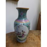 A CHINESE FAMILLE ROSE VASE DECORATED WITH FIGURAL AND FLORAL PANELS, CHARACTER MARK TO BASE. H.
