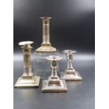 TWO PAIRS OF SILVER HALLMARKED CANDLESTICKS WITH REMOVABLE SCONCES AND WEIGHTED BASES. HEIGHT