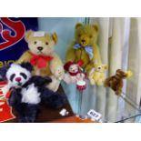 A STEIFF JOINTED TEDDY BEAR AND THREE MINIATURE STEIFF BEARS TOGETHER WITH TWO HERMANNS TEDDY