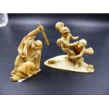 TWO JAPANESE IVORY OKIMONO, ONE OF A SEATED FIGURE RAISING A CLUB AS A RAT DISAPPEARS DOWN HIS