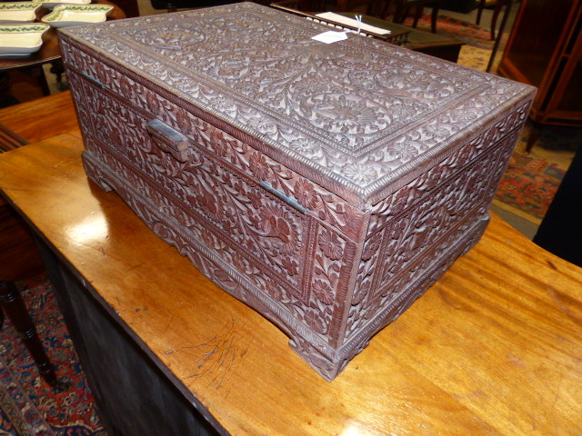 AN ANGLO INDIAN ELABORATELY CARVED HARDWOOD WORK BOX WITH LIFT TOP AND MIRROR BACK ENCLOSING - Image 4 of 4