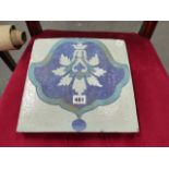 A LARGE MIDDLE EASTERN TILE WITH LEAF DECORATION. 28 X 28CMS.
