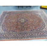 AN ANTIQUE PERSIAN KASHAN CARPET. 326 X 223CMS.