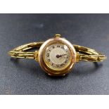 A VICTORIAN LADIES 9CT GOLD WRIST WATCH ON A GOLD FILLED EXPANDING STRAP, HALLMARKED 1869 WITH A