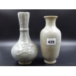 TWO CHINESE GUAN TYPE GREY CRACKLEWARE VASES, ONE OF BOTTLE SHAPE WITH FLUTING BELOW THE SERRATED