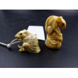 TWO JAPANESE MARINE IVORY RAT NETSUKES, EACH WITH INLAID EYES, ONE UNRAVELLING THE ROPE FROM HOTEI'S