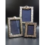 THREE HALLMARKED SILVER PHOTO FRAMES WITH VELVET BACKS, MEASUREMENTS 13CMS X 9.5CMS, (X2) AND 8.5CMS