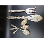 ROYALTY INTEREST. A PAIR OF ORNATE VICTORIAN SILVER FISH SERVERS, PIERCED WORK, HEAVY ENGRAVING