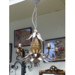 A DECORATIVE PAINTED AND GILT FIVE LIGHT CHANDELIER OF PINEAPPLE FORM WITH SCROLLING ARMS. W.56 X