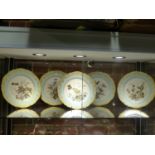 A SET OF FIVE LE ROSY PARIS PORCELAIN PLATES PAINTED BY VIVIEN WITH FRUIT, NUTS AND BUTTERFLIES