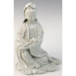 Chinese white porcelain sitting Guanyin figure holding a ruyi, 10 1/2"h.