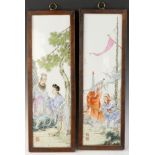 Pair of Chinese Famille Rose porcelain plaques with Chinese figures, 22 1/2" x 7 1/2".