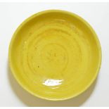 The porcelain dish covered with rich yellow enamel and crackles. Rare blue enamel incised mark on