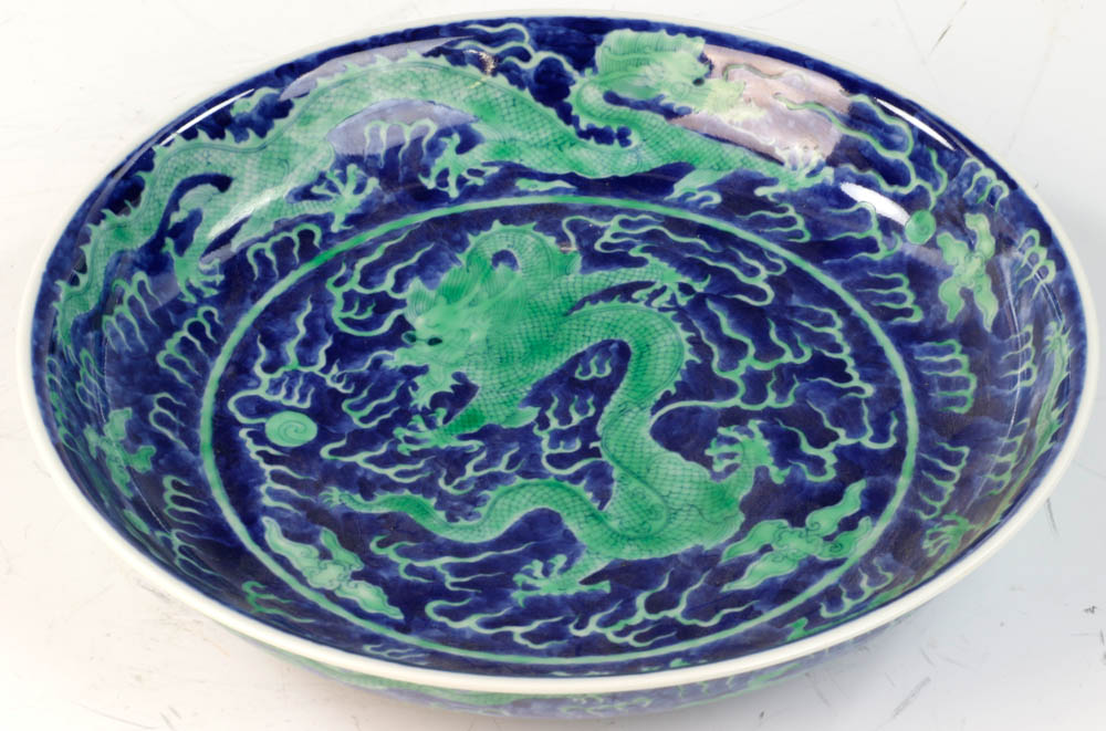 Chinese underglazed blue plate with green dragon design, Qing Daoguang mark on base, 11" diameter.