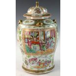 Chinese Rose Medallion jar, decorated with four carved foo lion handles, gilt flowers and figures,