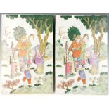 Pair of Chinese Famille Rose porcelain plaques decorated with Chinese figures, 15 1/2" x 10".