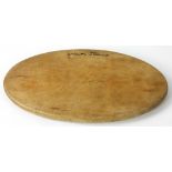 Oval cutting board, signed Martha Stewart, approximately 18" L x 10" W. Provenance: Studio Props