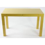 West Elm yellow lacquered parsons table. Provenance: Studio Props of Martha Stewart.