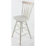 White-painted high swivel chair, signed Martha Stewart, 47" H x 19". Provenance: Studio Props of
