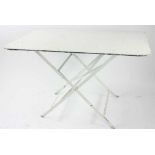 White folding metal table, 29" H x 31" W x 46" L. Provenance: Studio Props of Martha Stewart.