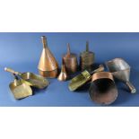 Collection of copper and brass items including four funnels and five scoops. Provenance: Studio