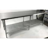 Stainless kitchen prep table, 34" H x 8' L x 30" W. Provenance: Studio Props of Martha Stewart.