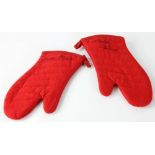 Signed Martha Stewart red oven mitts. Provenance: Studio Props of Martha Stewart.