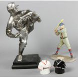 Three baseball-themed decorative items to include cast iron doorstop, composition figure of a