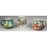 Group of three French Limoges handpainted water pitchers. Tallest 7 1/2", with marks for Haviland.