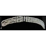 Pearl bracelet with 14k white gold diamond clasp and bar, pearls approximately 3.5 to 4.0mm. 6 1/