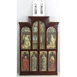 Late 19th century altarpiece in folding triptych-form, chromolithographs framed in walnut. This