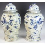 Pair of Chinese porcelain temple jars having dragon bird scenes, 20" H. Provenance: Wakefield,