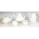 English Shelley tea set, ivory color with gold rim, with a Royal Albert teapot. Five (5) pieces