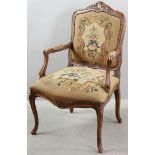 Armchair with needlepoint and petit point upholstery, 38" H x 24" W x approximately 21" D.